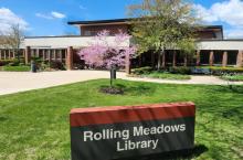 Building Exterior Of Rolling Meadows Library showing Library name on grass lawn